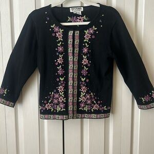 Beautiful black sweater with embroidered beaded Purple and light purple flowers.